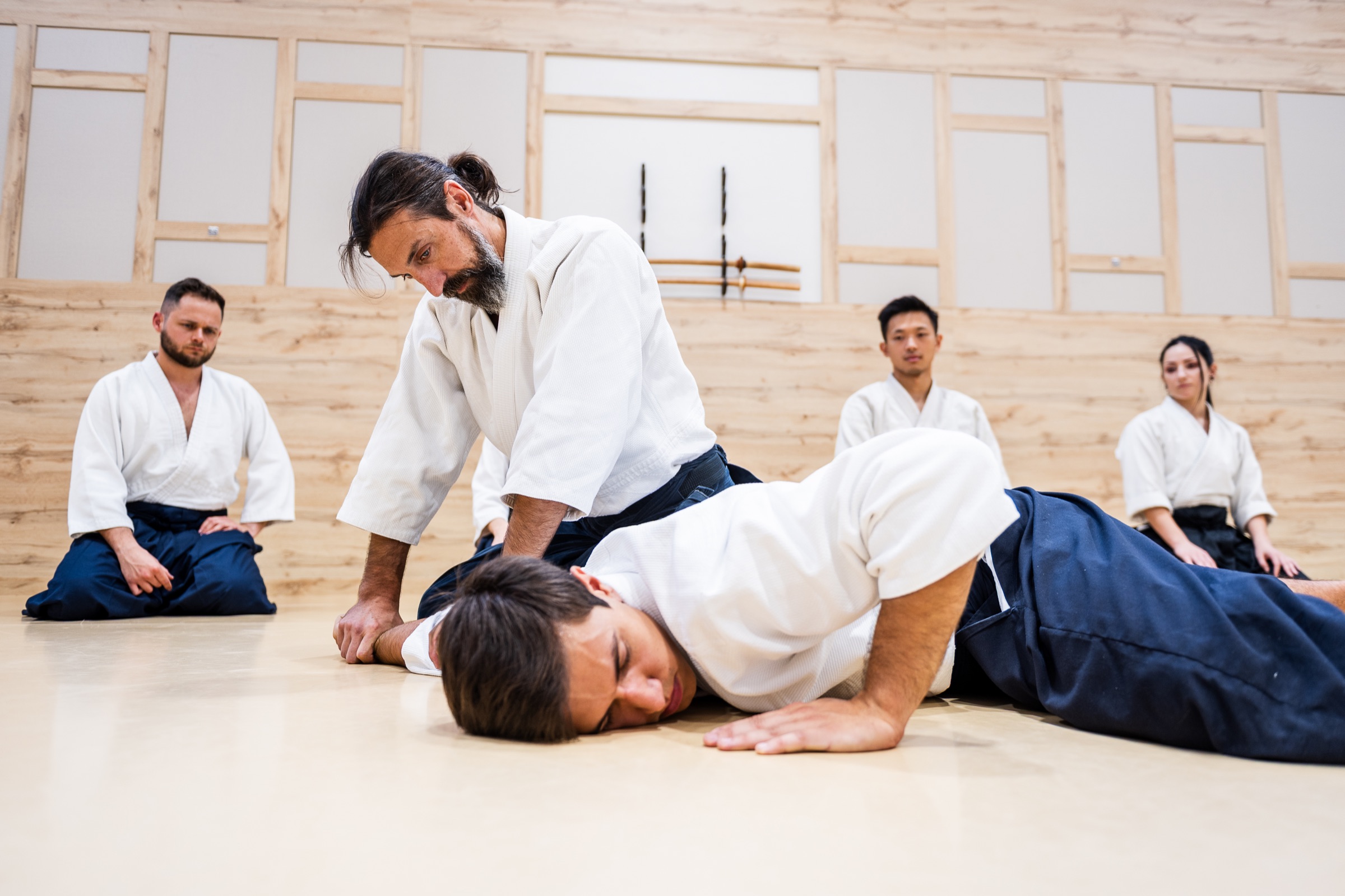 A pin on the floor, with the class watching.