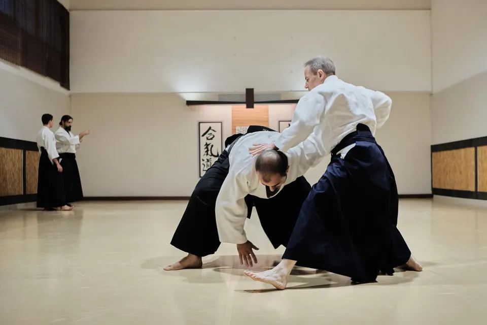 Kaiten-nage (回転投げ) or the technique where tori sweeps the arm back un